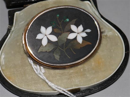 A late 19th century Continental yellow metal oval brooch with pietra dura floral inlay, in fitted box marked O. Landry a Geneve